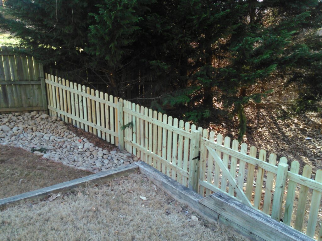 This 4 ft space picket dog eared fence is constructed using 2x4 runners using 4x4 post and 1 x 4 pressure treated pine dog eared pickets